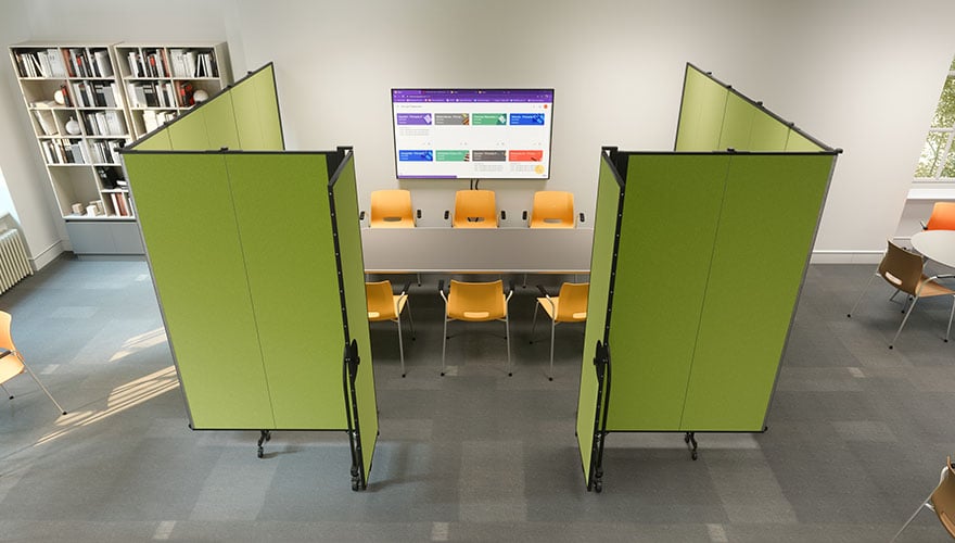Green Portable room dividers enclose a meeting space