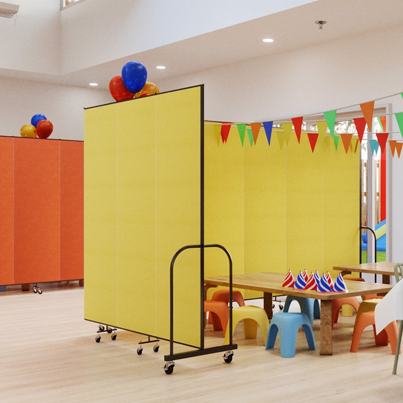 yellow room divider partially surrounding a kids' party area