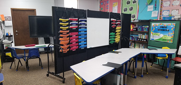 Classroom with black partition and whiteboard in the center