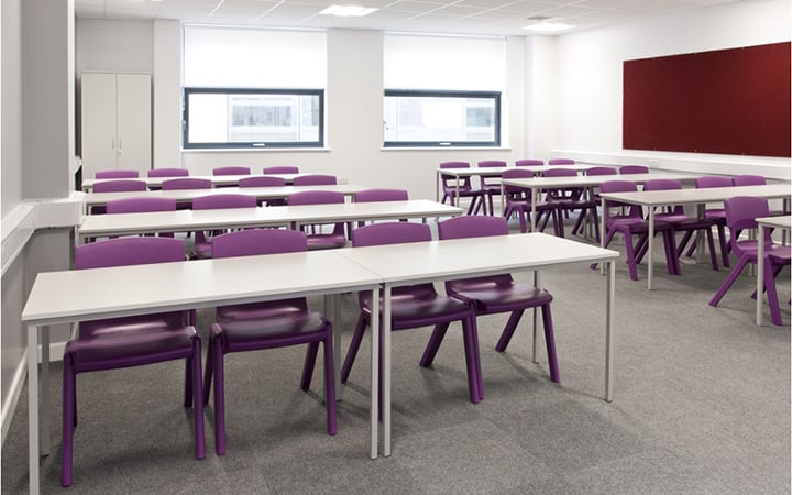 Classroom with rows of chairs and desks