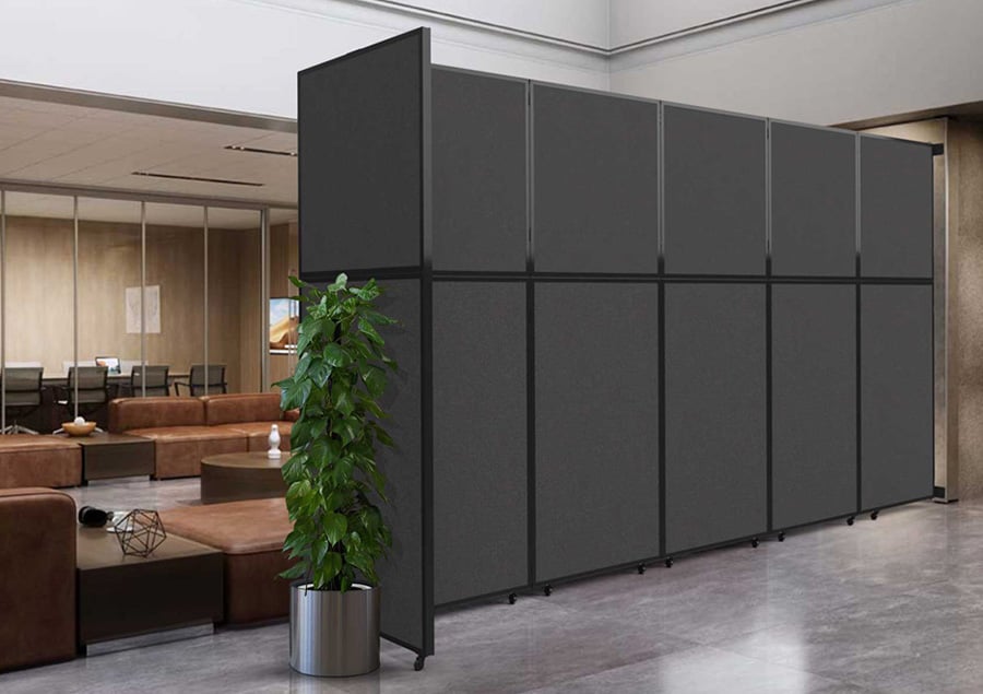 Large black room divider sectioning space in waiting area