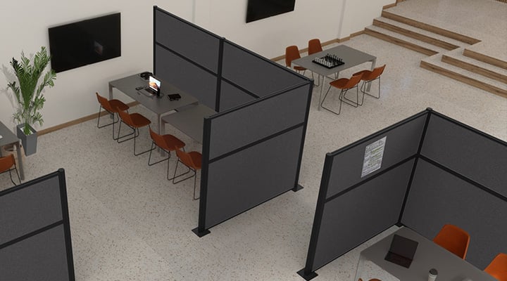 Gray cubicles partially surrounding workspaces 