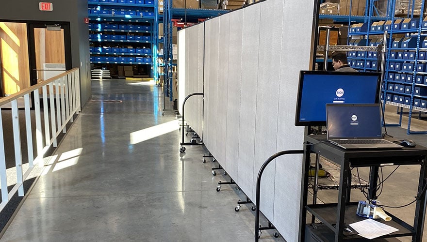 gray room divider in a warehouse setting