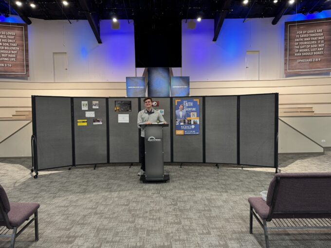 Room Divider is used as a background with the poster posted